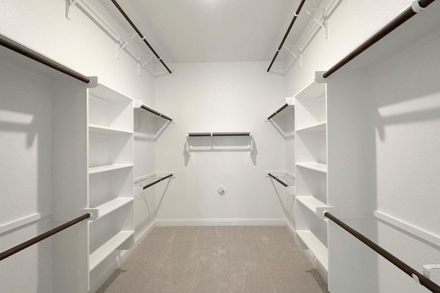 Ample shelving and hanging space in this well-appointed, ready-to-organize closet.
