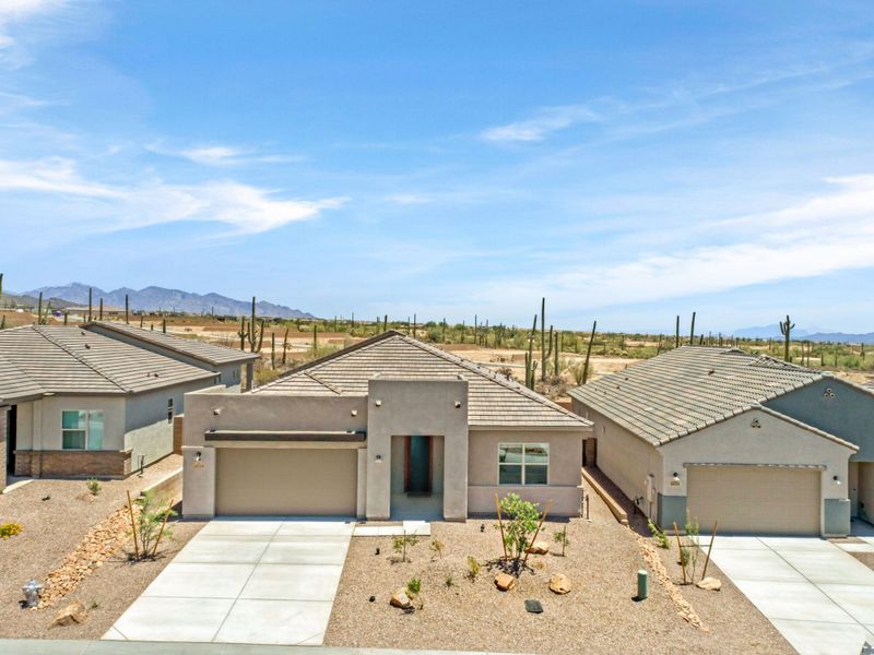 Front exterior of a new home in Saguaro Reserve II, Marana, AZ, highlighting curb appeal (Image 2).