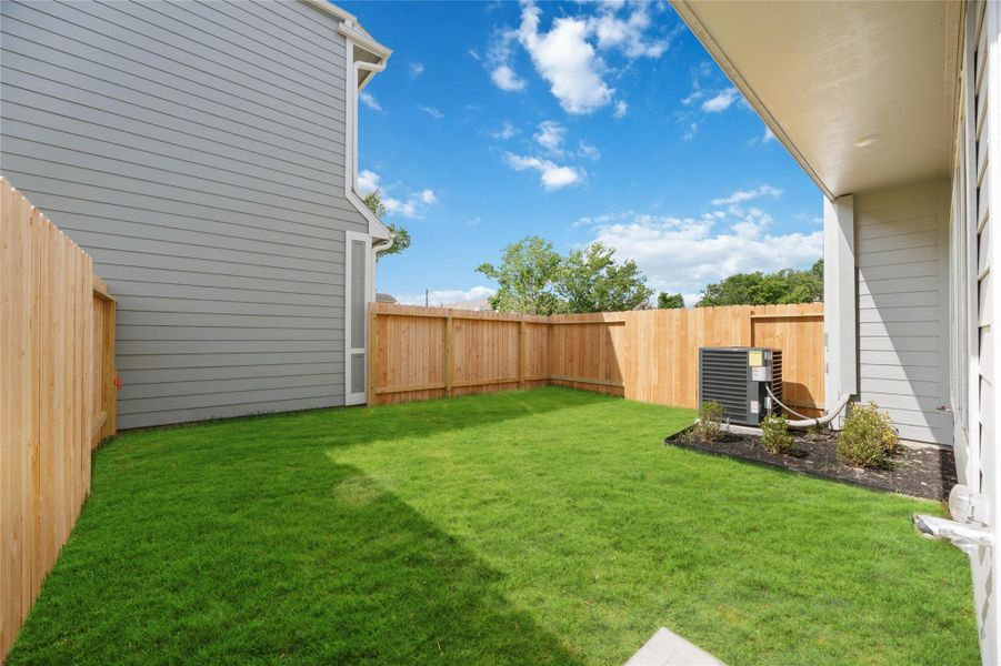 Grilling Greatness: Ready for your culinary exploits outdoors with a convenient natural gas connection in your private, fenced back yard.