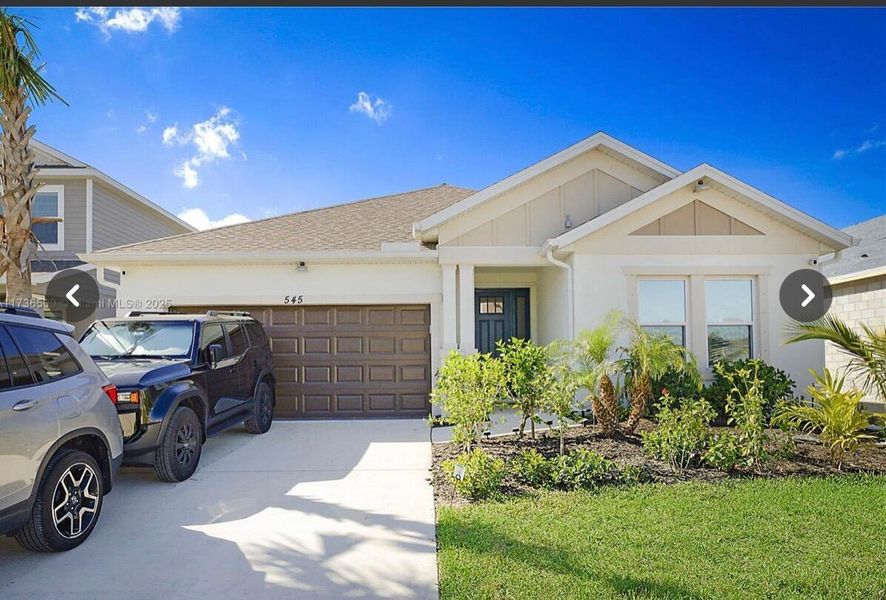 Front exterior of a new home in , Port St. Lucie, FL, highlighting curb appeal (Image 19).