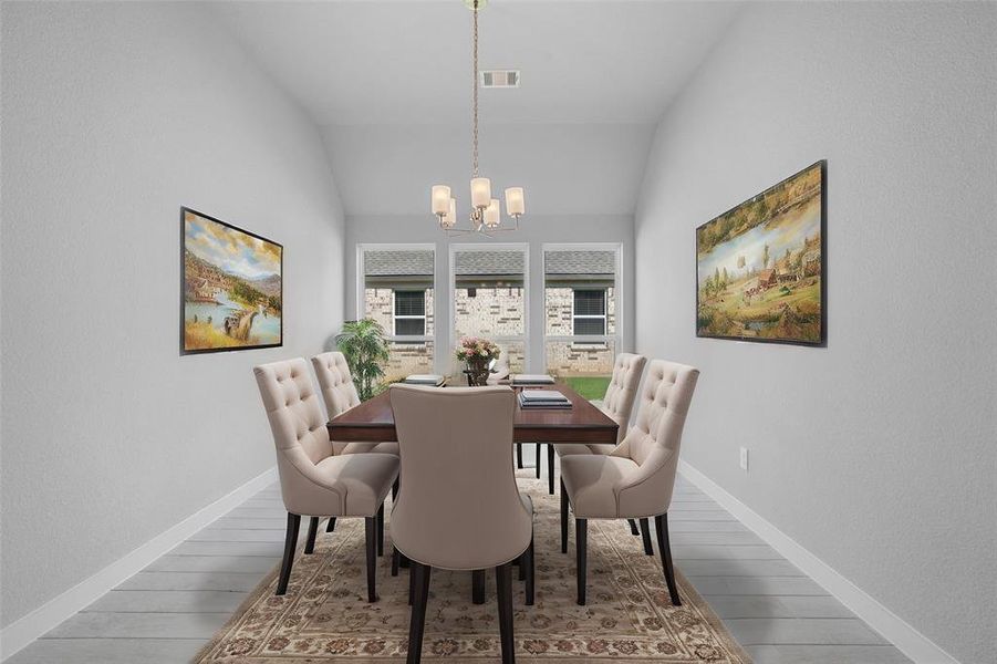 Secondary bedroom features plush carpet, neutral paint, lighting and a large window with plenty of natural light.