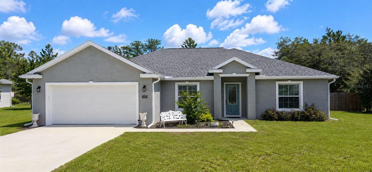 Front exterior of a new home in , Ocala, FL, highlighting curb appeal (Image 2). Front exterior of a new home in , Ocala, FL, highlighting curb appeal (Image 2).