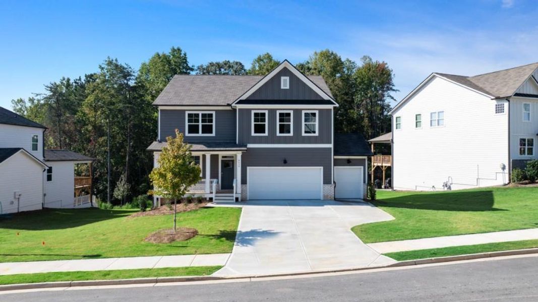 Front exterior of a new home in Falcon Landing, Gainesville, GA, highlighting curb appeal (Image 15).