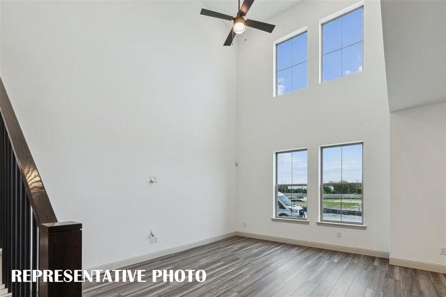 Featuring volume windows in the family room, this beautiful home is filled with natural light. REPRESENTATIVE PHOTO Featuring volume windows in the family room, this beautiful home is filled with natural light. REPRESENTATIVE PHOTO