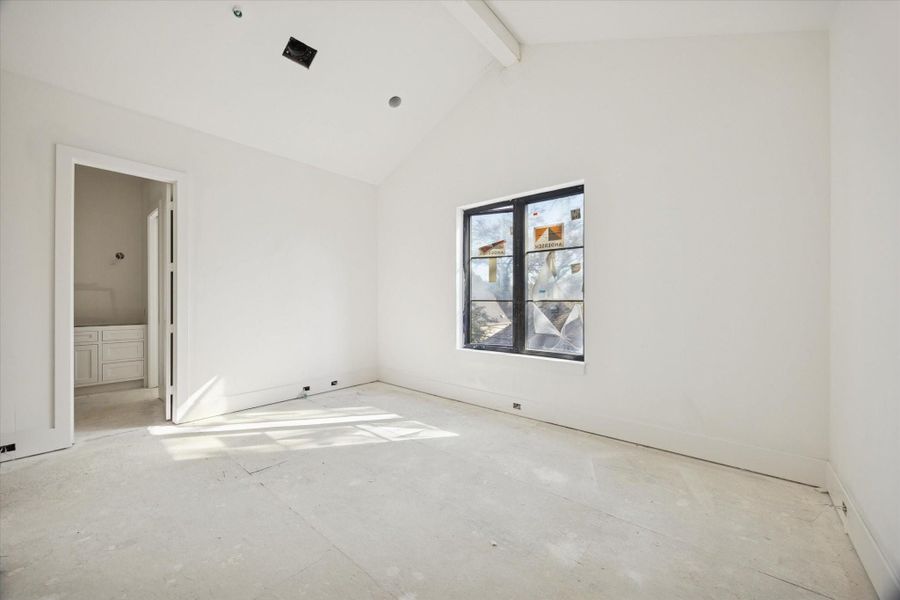 One of the secondary bedrooms with ensuite bathroom and walk-in closet. Pictured February 2026.