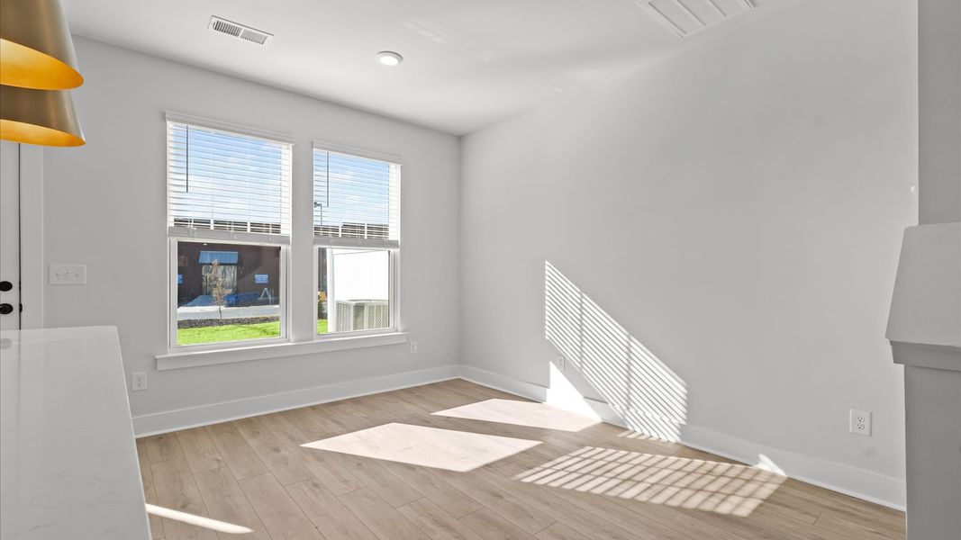 Memorable meals start in this exclusive dining area featuring elegant trim and natural light