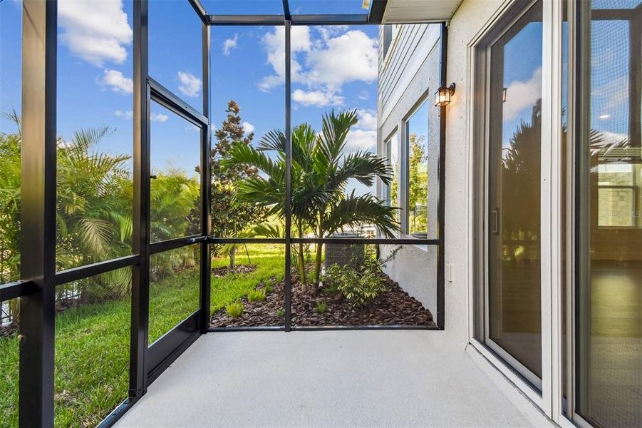 Exterior details and patio area of a home in North River Ranch – Townhomes, Parrish (Image 26).