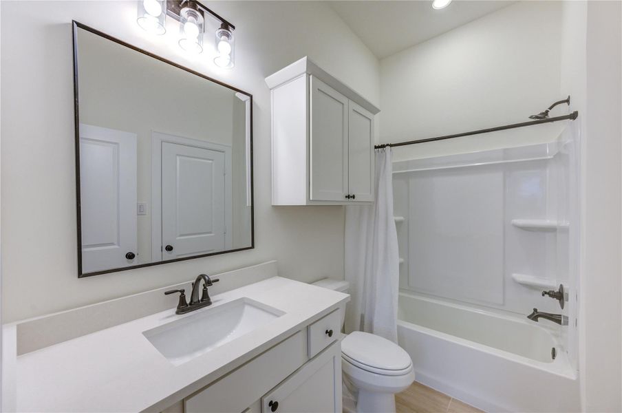 This bright and modern bathroom features sleek fixtures, ample storage, and a spacious tub, offering a perfect blend of style and functionality. This bright and modern bathroom features sleek fixtures, ample storage, and a spacious tub, offering a perfect blend of style and functionality.