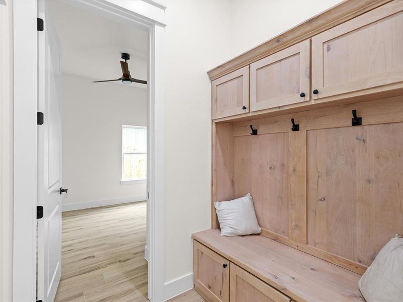Mudroom featuring light wood-type flooring and a ceiling fan