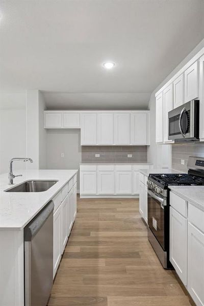 Kitchen in the Heisman home plan by Trophy Signature Homes – REPRESENTATIVE PHOTO