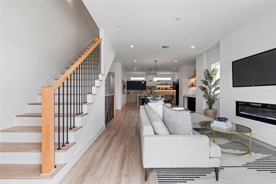 From the patio, enjoy a full view into the home’s main living area—an inviting open space that ties the kitchen, dining, and living room together. From the patio, enjoy a full view into the home’s main living area—an inviting open space that ties the kitchen, dining, and living room together.