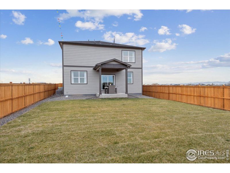Front exterior of a new home in Carriage Hills, Frederick, CO, highlighting curb appeal (Image 21). Front exterior of a new home in Carriage Hills, Frederick, CO, highlighting curb appeal (Image 21).