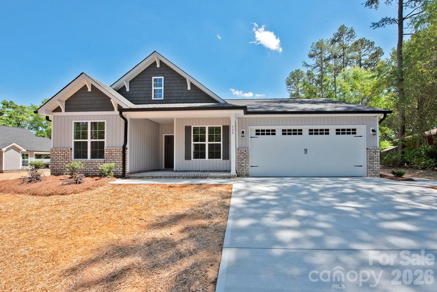 Front exterior of a new home in , Concord, NC, highlighting curb appeal (Image 18).