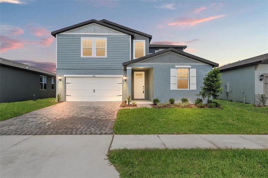 Front exterior of a new home in Two Rivers - Classic Series, Zephyrhills, FL, highlighting curb appeal (Image 24).