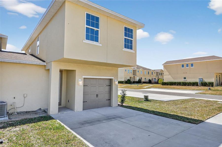 Front exterior of a new home in , Davenport, FL, highlighting curb appeal (Image 24).