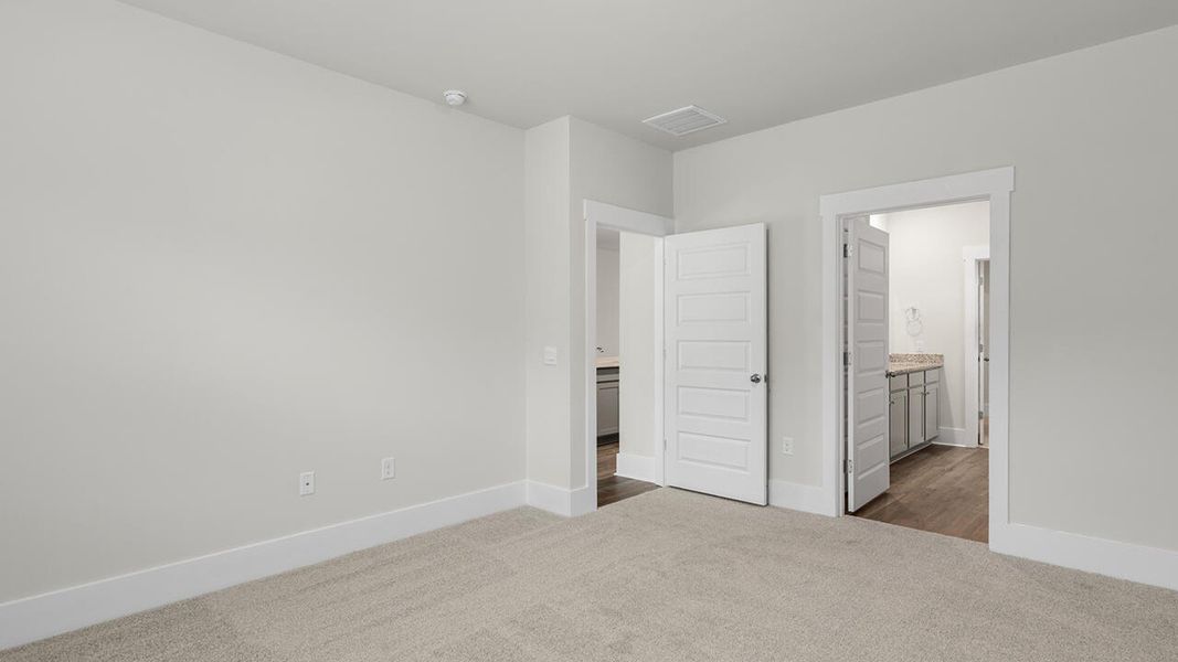 Spacious, unfurnished interior of a new home in The Haven at Indigo Preserve, Leland (Image 24).