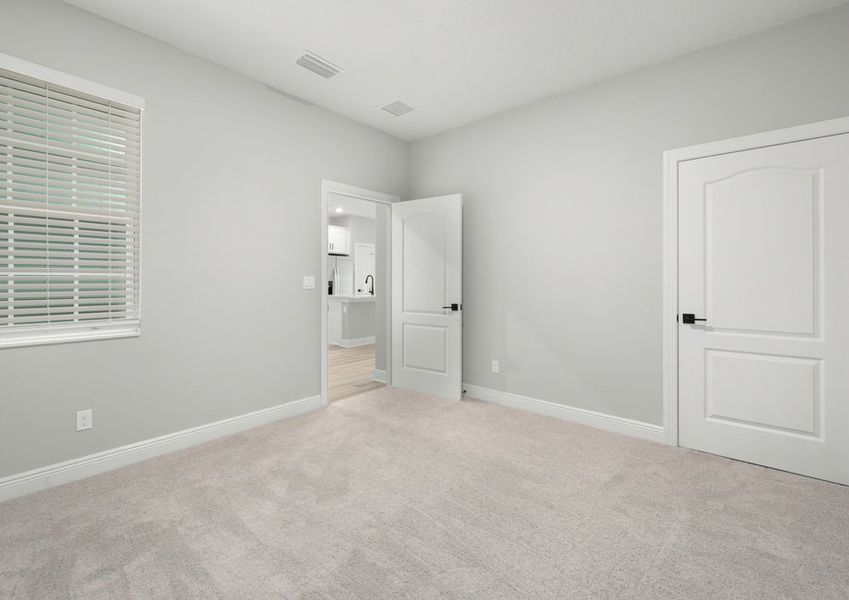 Bedroom with carpet flooring Bedroom with carpet flooring