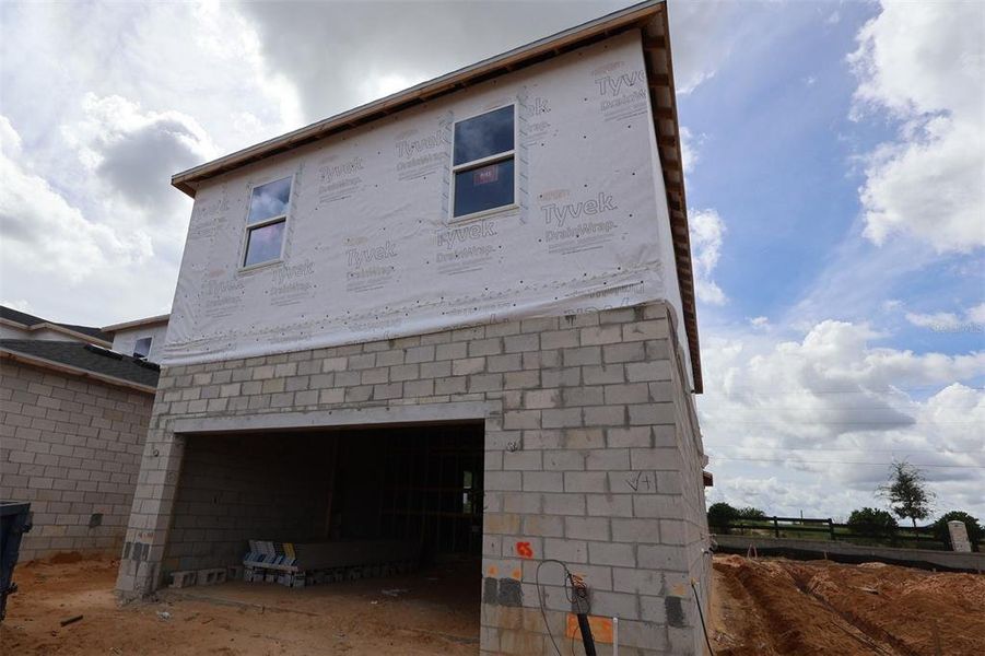 In-progress construction of a new home in Lake Star at Ovation, Winter Garden, FL (Image 25).