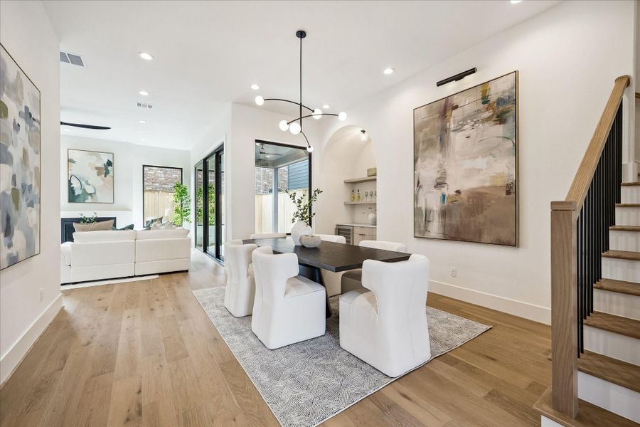 Dining area - offers designer lighting fixture and a dry bar. Dining area - offers designer lighting fixture and a dry bar.