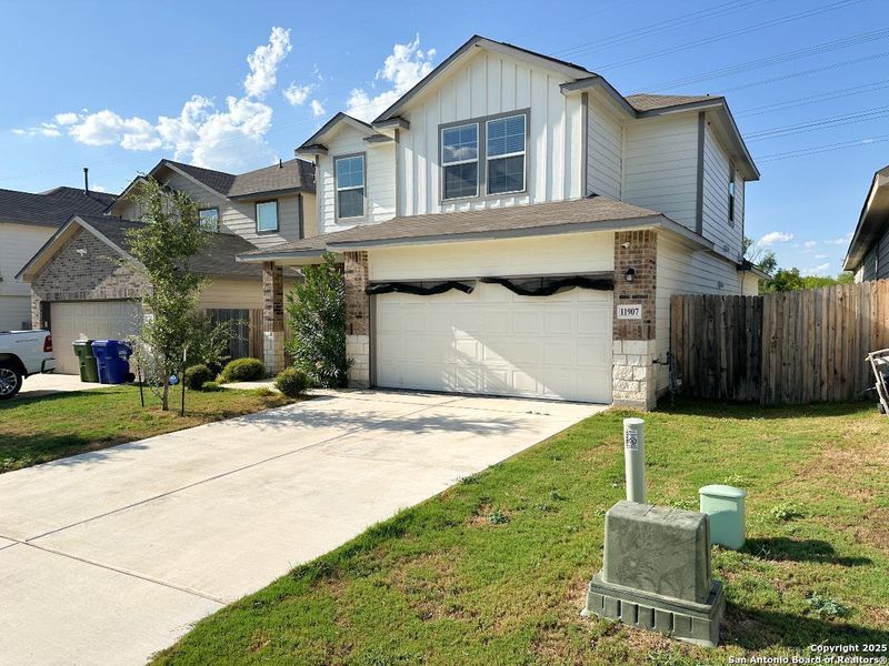 Front exterior of a new home in Stoney Creek, San Antonio, TX, highlighting curb appeal (Image 18). Front exterior of a new home in Stoney Creek, San Antonio, TX, highlighting curb appeal (Image 18).
