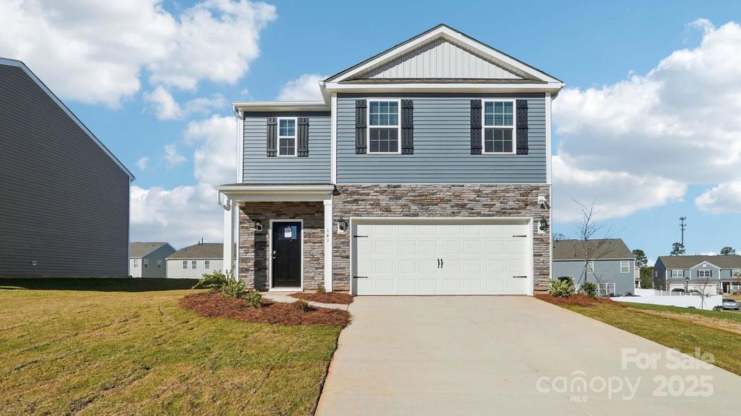Front exterior of a new home in Wallace Springs, Statesville, NC, highlighting curb appeal (Image 2). Front exterior of a new home in Wallace Springs, Statesville, NC, highlighting curb appeal (Image 2).