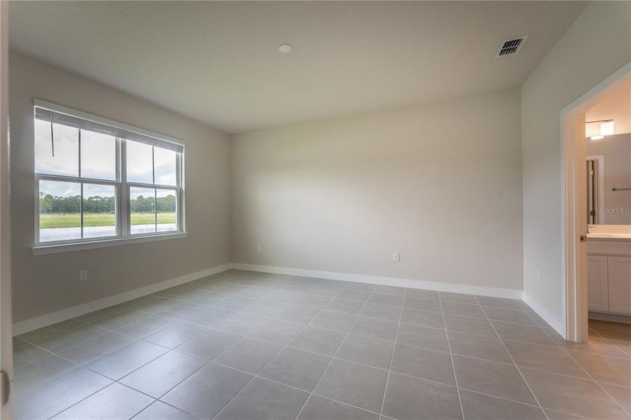 Spacious, unfurnished interior of a new home in The Palms at Venetian Bay, New Smyrna Beach (Image 23).