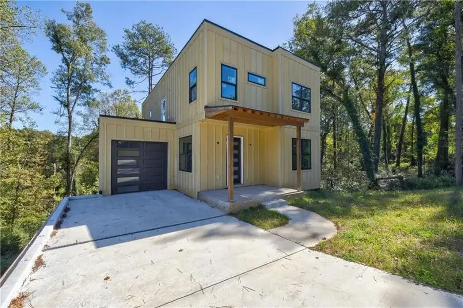 Front exterior of a new home in , Hapeville, GA, highlighting curb appeal (Image 11).