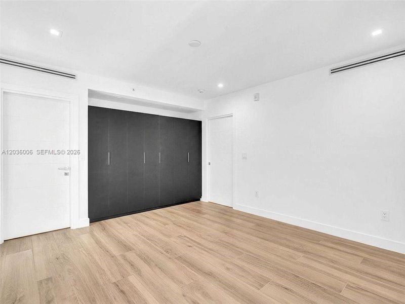 Bedroom with Wall unit closets
