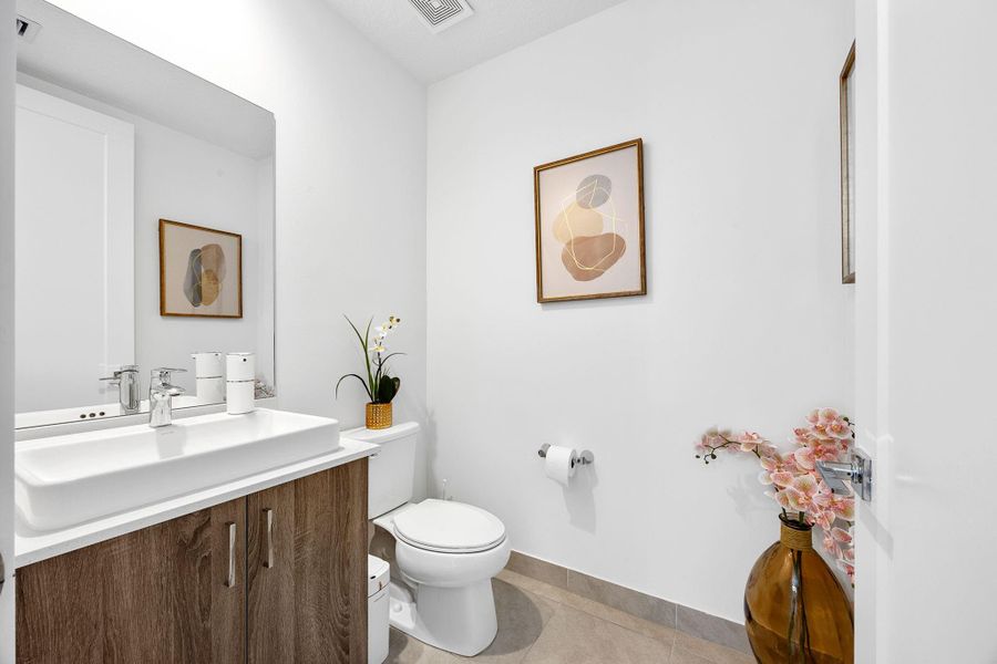Bathroom featuring vanity and light tile patterned floors