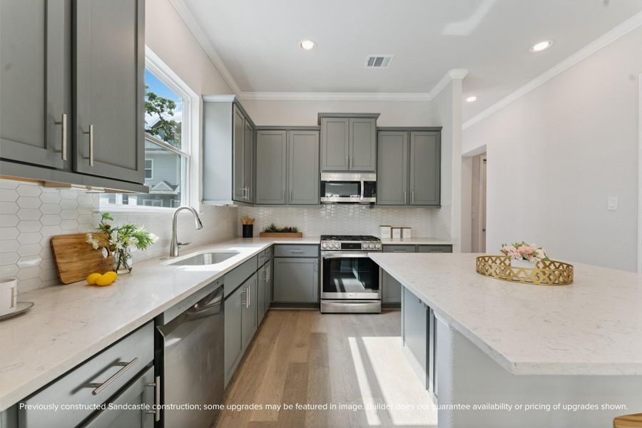 Premium Finishes Up Close – A closer look reveals LG’s sleek stainless steel appliances and a modern Moen faucet—blending form and function for a kitchen that’s as hardworking as it is beautiful.