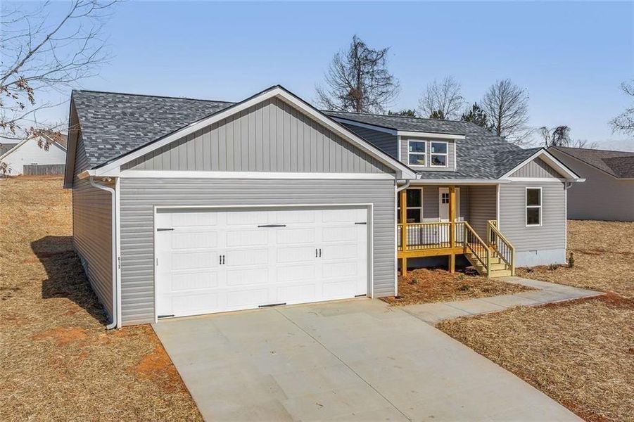 Front exterior of a new home in , Mount Airy, GA, highlighting curb appeal (Image 1). Front exterior of a new home in , Mount Airy, GA, highlighting curb appeal (Image 1).