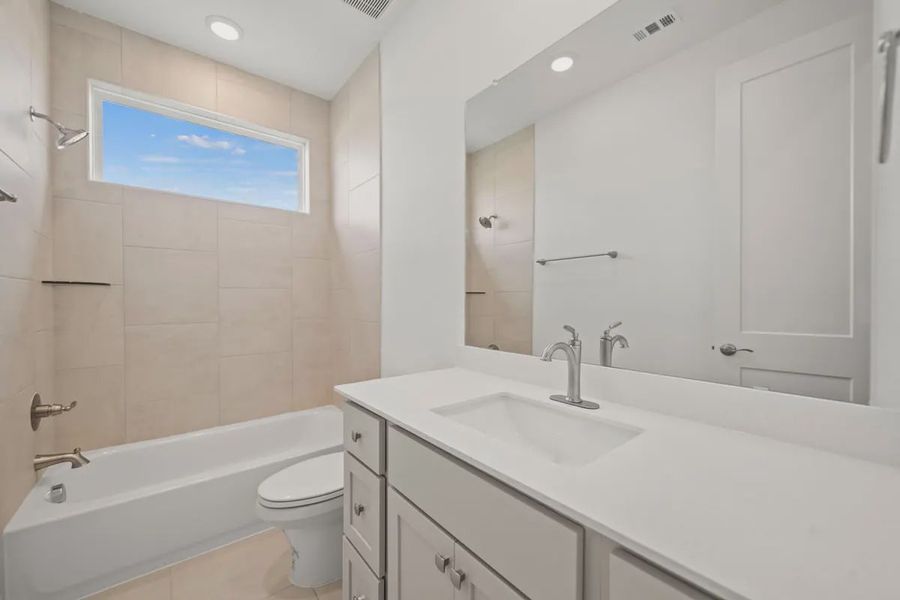 Representative furnished interior of a home built from the Mariah by Chesmar Homes in Lakes of Cane Island, Katy (Image 6).