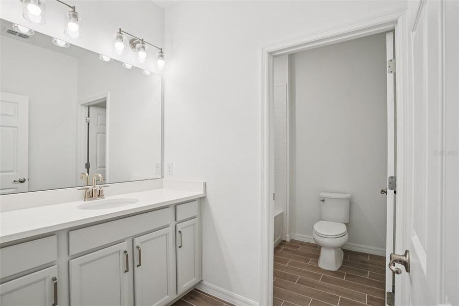 Furnished interior view inside a new home in Trinity Gardens, Deland (Image 6).