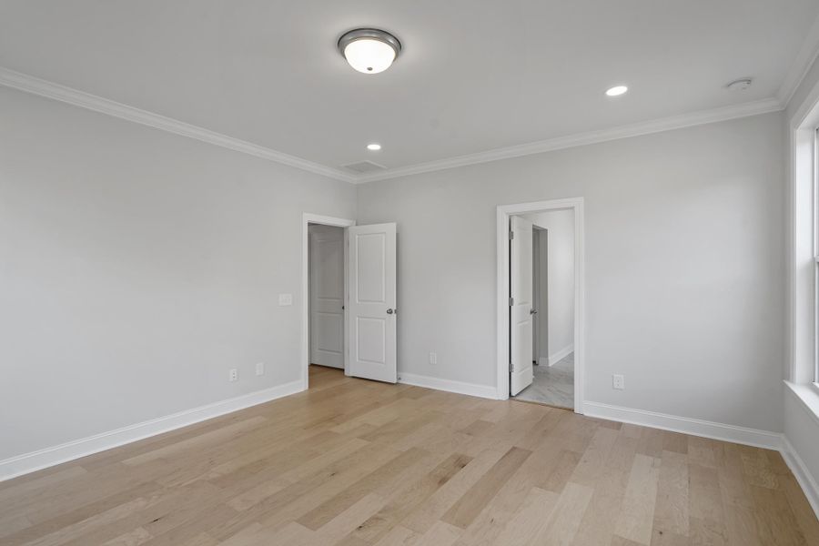 Spacious, unfurnished interior of a new home in K. Hovnanian's® Four Seasons at Lakes of Cane Bay, Summerville (Image 17).