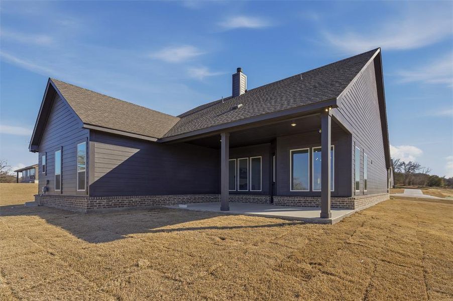 Exterior details and patio area of a home in Oak Grove Addition, Springtown (Image 23).