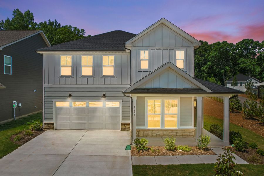 Front exterior of a new home in Elmbrook, Indian Trail, NC, highlighting curb appeal (Image 31). Front exterior of a new home in Elmbrook, Indian Trail, NC, highlighting curb appeal (Image 31).