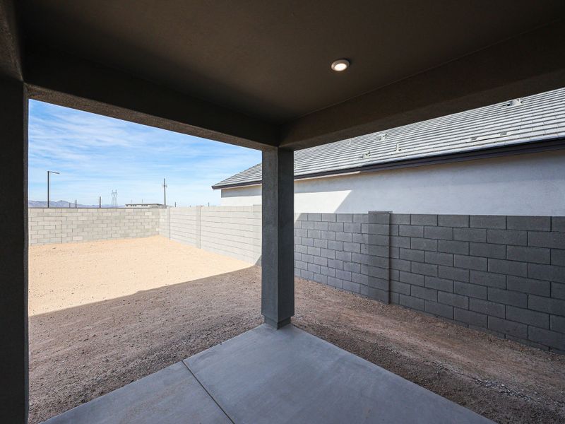A concrete wall with a brick walkway. A concrete wall with a brick walkway.