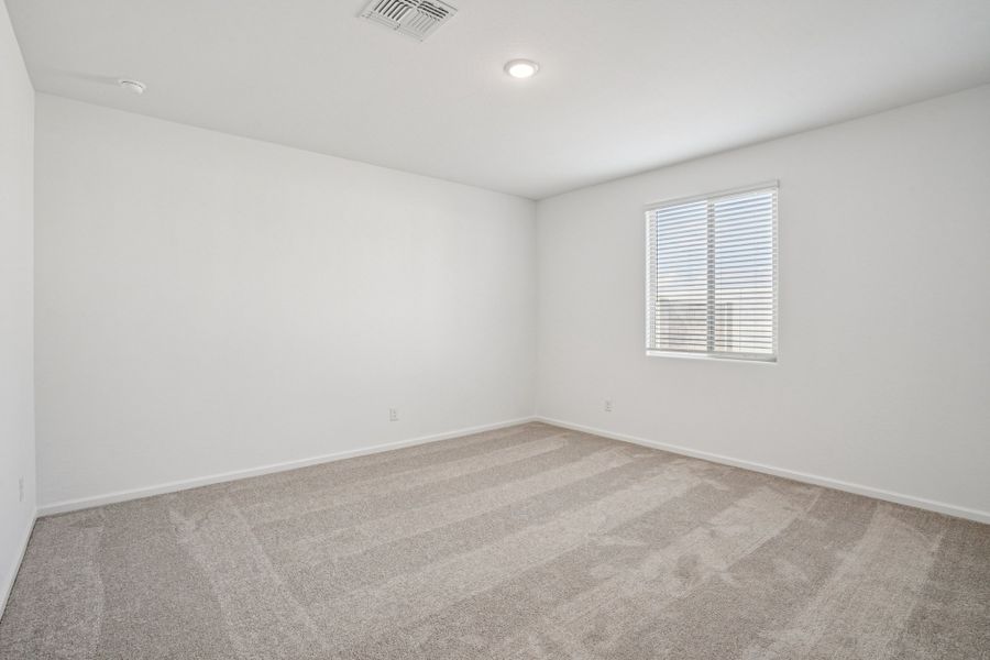 Primary suite. Finishes may vary by community.