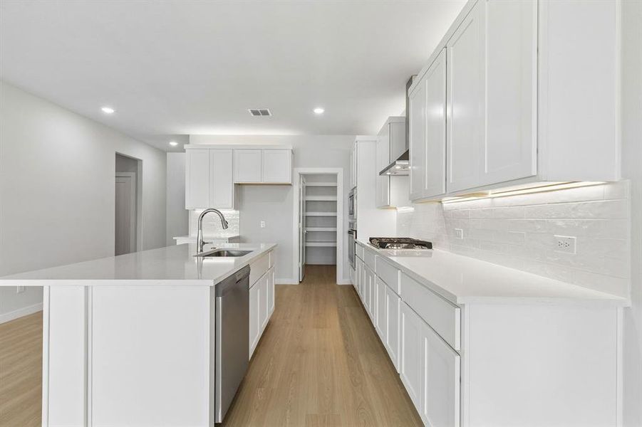 Kitchen in the Winters home plan by Trophy Signature Homes – REPRESENTATIVE PHOTO Kitchen in the Winters home plan by Trophy Signature Homes – REPRESENTATIVE PHOTO