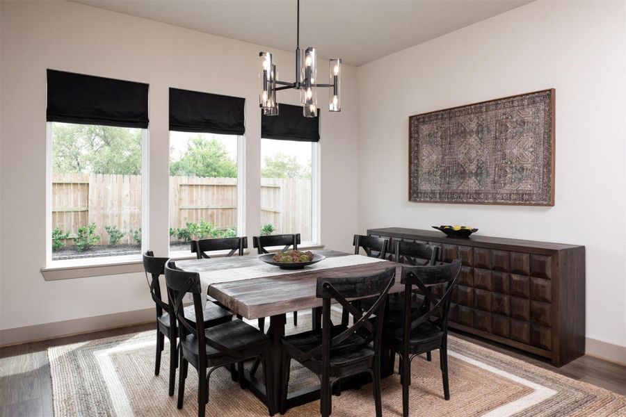 The dining area is a perfect blend of style and functionality, providing an inviting space for memorable meals and gatherings.