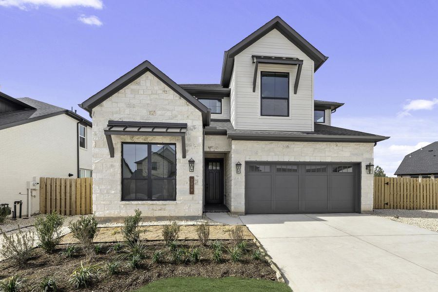 Front exterior of a new home in COLTON®, Montgomery, TX, highlighting curb appeal (Image 2). Front exterior of a new home in COLTON®, Montgomery, TX, highlighting curb appeal (Image 2).