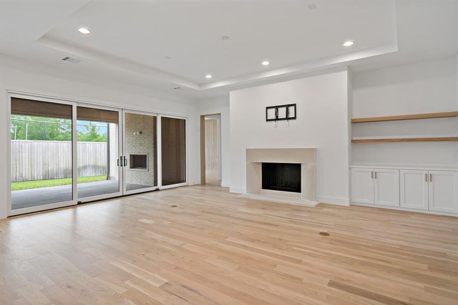 The living room offers access to the covered back patio through huge sliding glass doors.