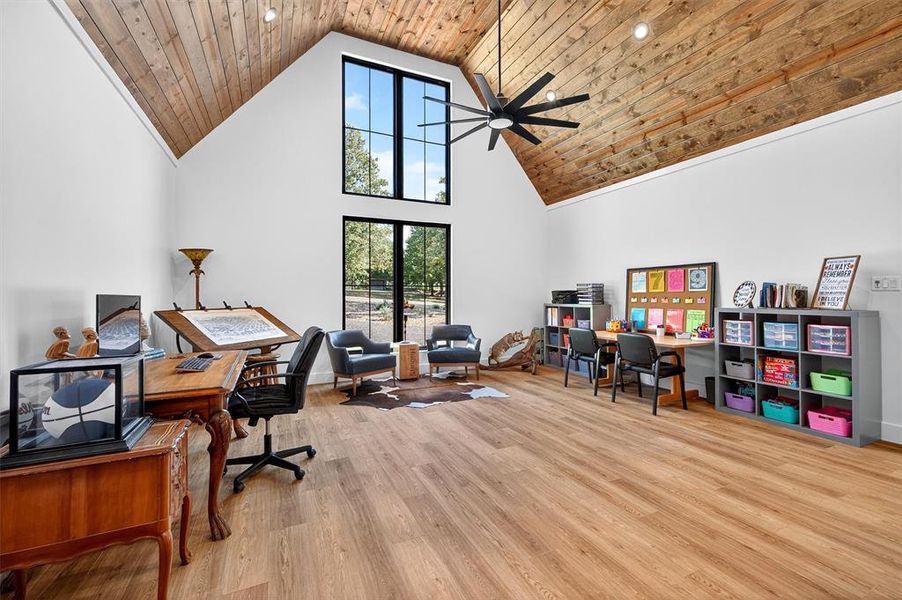 Home office with high vaulted ceiling, ceiling fan, wooden ceiling, light wood-style flooring, and recessed lighting Home office with high vaulted ceiling, ceiling fan, wooden ceiling, light wood-style flooring, and recessed lighting