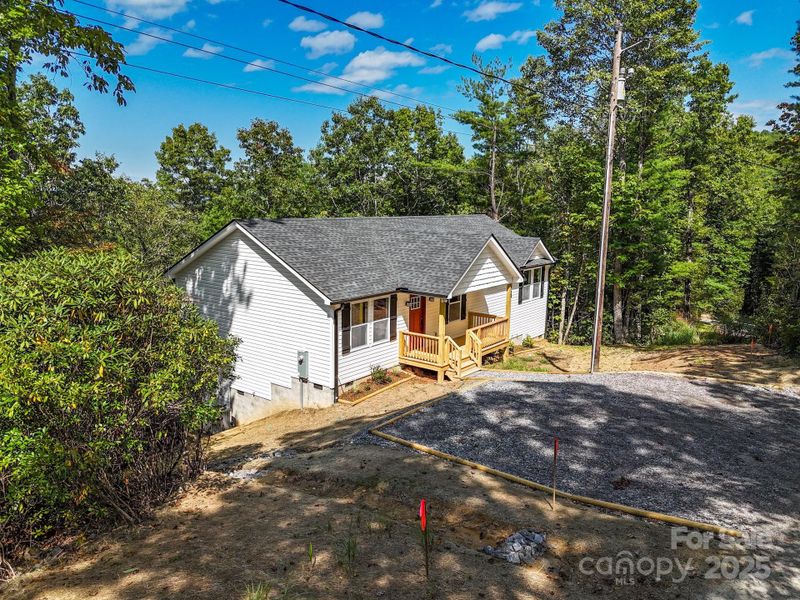 Front exterior of a new home in , Etowah, NC, highlighting curb appeal (Image 21).