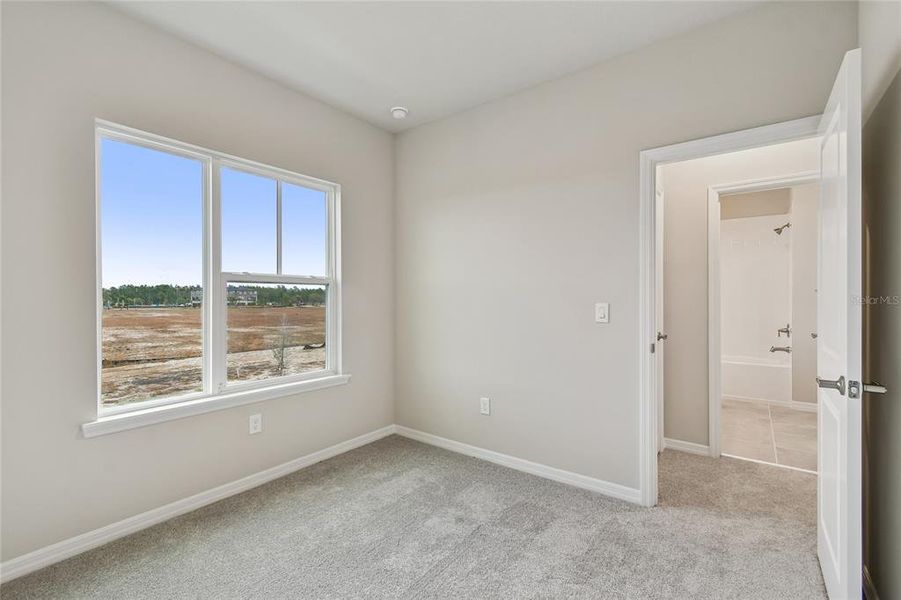 Spacious, unfurnished interior of a new home in Laureate Park at Lake Nona - Garden Series, Orlando (Image 32).