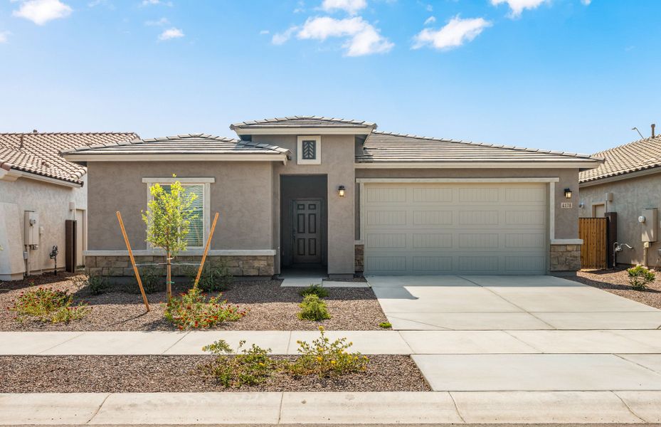 Front exterior of a new home in El Cidro, Goodyear, AZ, highlighting curb appeal (Image 1). Front exterior of a new home in El Cidro, Goodyear, AZ, highlighting curb appeal (Image 1).