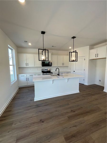 This modern kitchen features a spacious island and