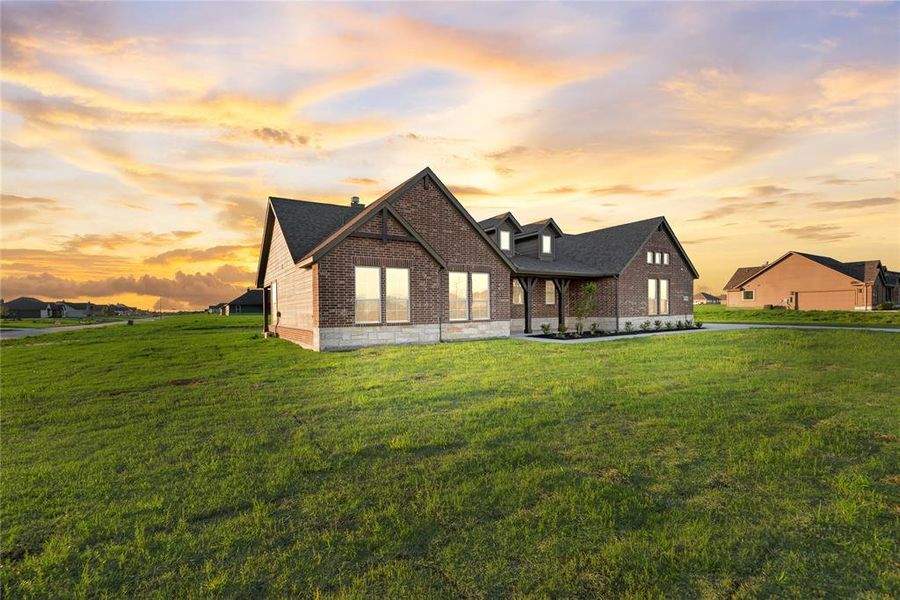 Front exterior of a new home in Oak Valley, Oak Ridge, TX, highlighting curb appeal (Image 24).
