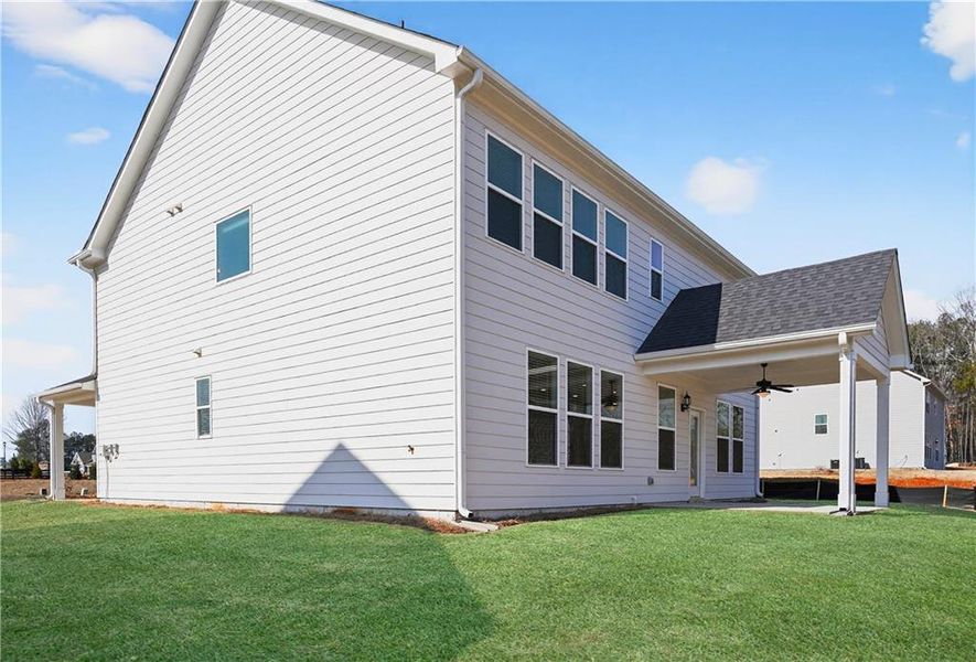 Exterior details and patio area of a home in The Fairways at Mirror Lake, Villa Rica (Image 20).