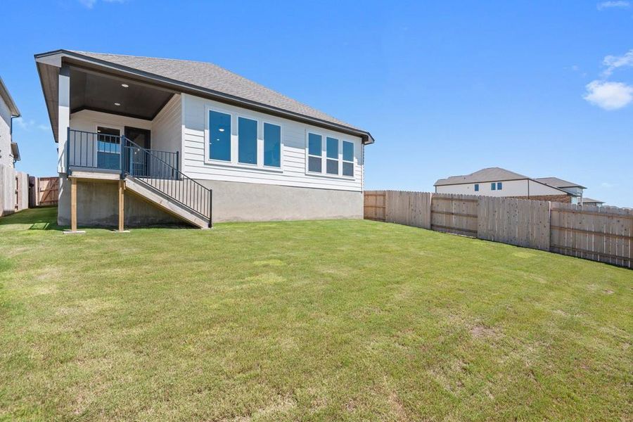 Front exterior of a new home in Park Collection at Lariat, Liberty Hill, TX, highlighting curb appeal (Image 2). Front exterior of a new home in Park Collection at Lariat, Liberty Hill, TX, highlighting curb appeal (Image 2).